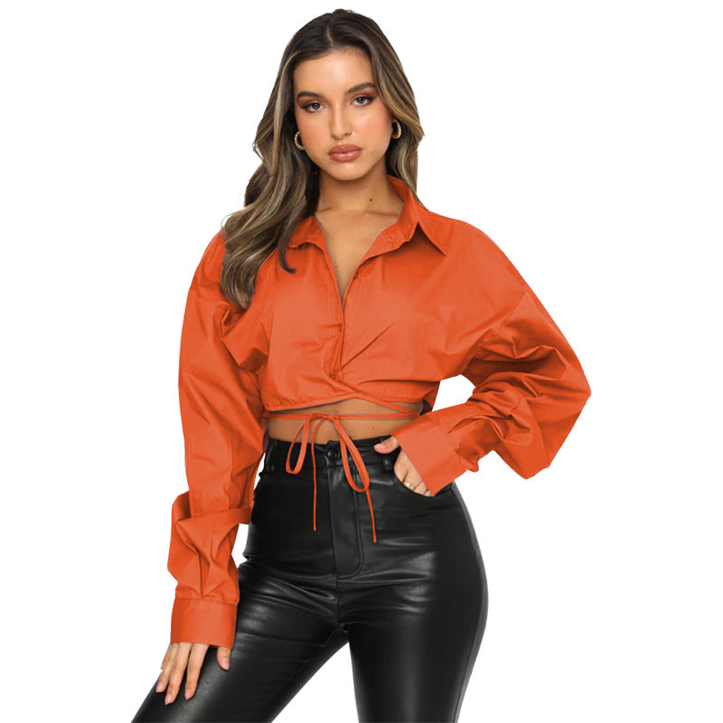 Long sleeved, short, loose fitting solid color cardigan with tie up collar and single breasted urban casual fashion shirt