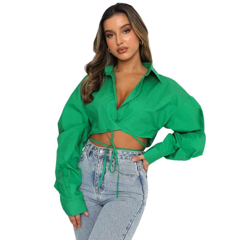 Long sleeved, short, loose fitting solid color cardigan with tie up collar and single breasted urban casual fashion shirt
